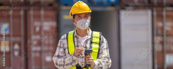 Fototapeta Foreman or worker work at Container cargo site check up goods in container. Foreman or worker checking on shipping containers. Logistics and shipping