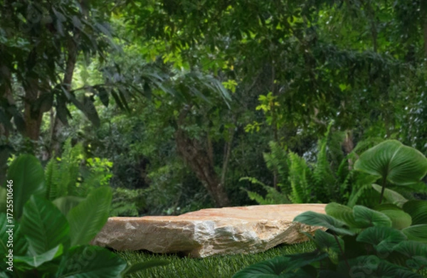 Fototapeta Stone podium stand with green tropical forest nature background.natural product pedestal rock table top display.jungle paradise concept.