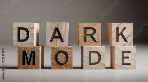 Fototapeta Wooden blocks on a surface arranged to spell "DARK MODE" in a clear, bold typeface, suggesting a theme or setting option.