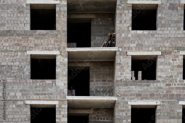 Fototapeta construction of new real estate and living spaces, an apartment building without decoration