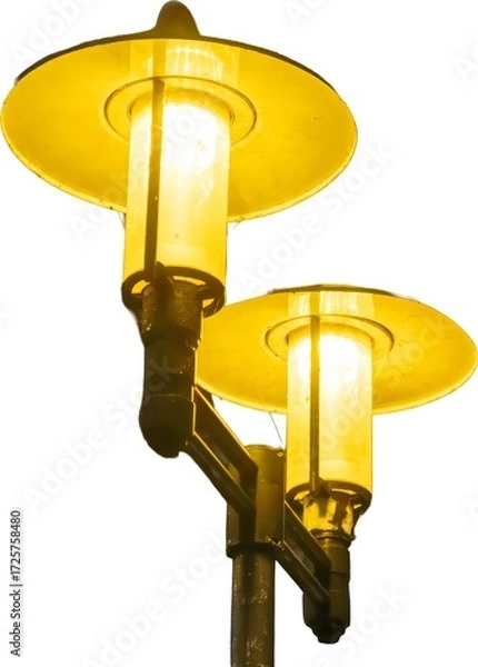 Fototapeta Vintage street lamp illuminating a pathway in an urban setting during the evening hours