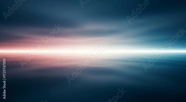 Obraz A blurred seascape shows a pink and white horizon line between dark sky and water