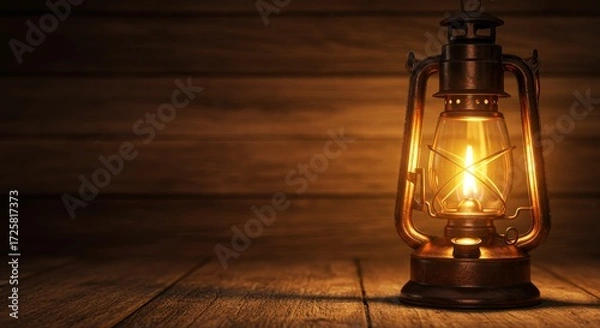 Fototapeta Illuminated Oil Lantern on Wooden Surface - A glowing oil lantern sits on a dark wooden surface, creating a warm and inviting atmosphere. Perfect for themes of adventure, history, or rustic charm