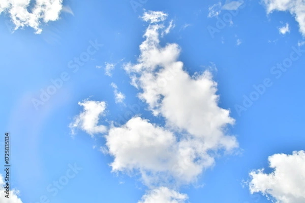 Obraz White Clouds in Blue Sky