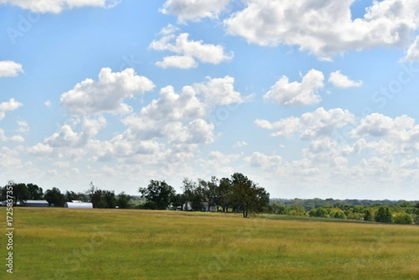 Obraz Clouds Over a Farm Field