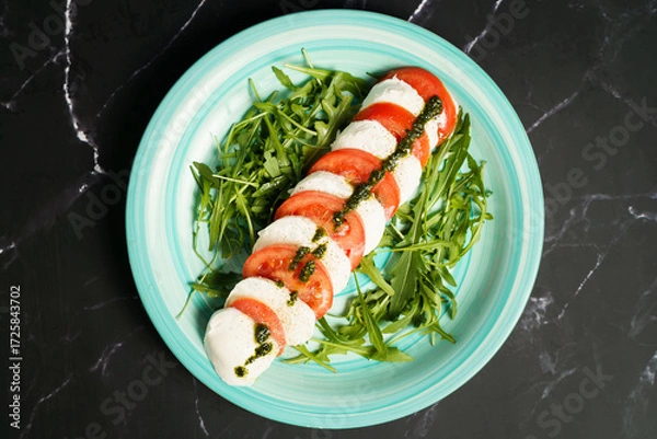 Obraz Caprese salad with mozzarella and arugula