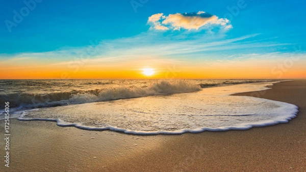 Fototapeta Beautiful sunrise on the beach with sea wave and cloud on sky