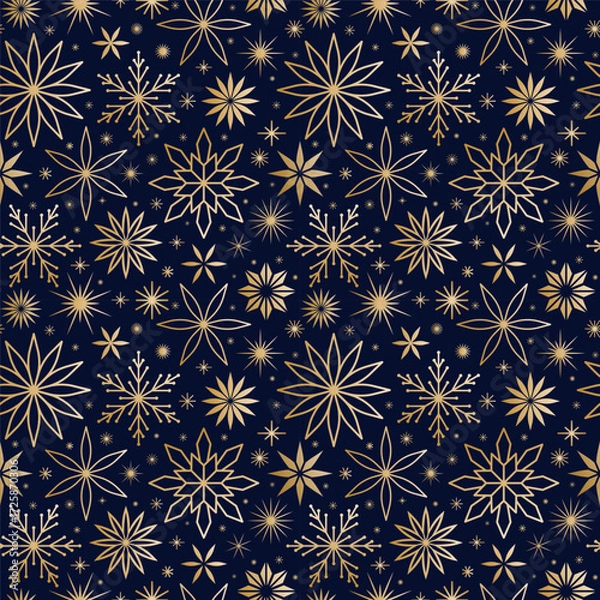 Fototapeta Elegant seamless pattern of golden snowflakes and stars on dark background. Luxury festive texture for Christmas, New Year, winter holiday design, gift wrap, wallpaper, textile, decorative projects