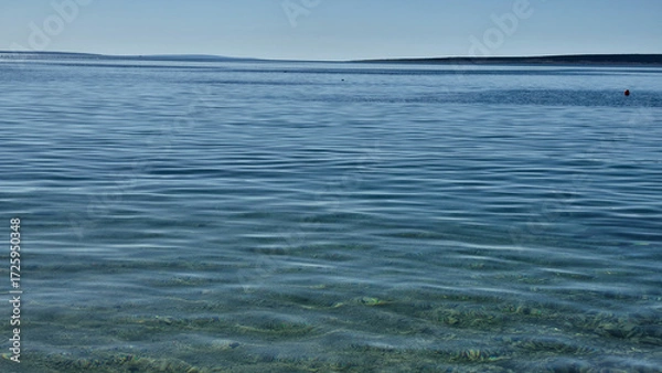 Fototapeta View of the blue sea and transparent sea surface from the land