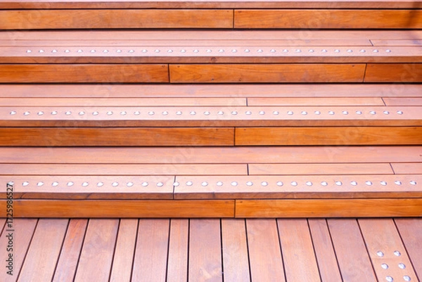 Fototapeta Teak wood steps of outdoor stairs and walkway with stainless steel screws decorating on surface in vintage design, High angle and front view with copy space