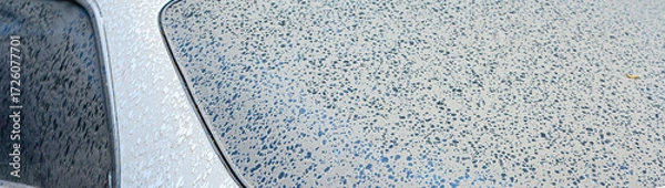 Fototapeta The first drops of water reach the surface of a dirty car requiring washing and cleaning, leading to corrosion and vehicle diagnostics at a service center