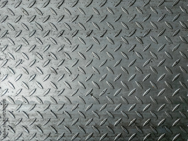 Fototapeta Structure of the background in the form of a gray metal diamond plate, also known as checkered plate or tread plate