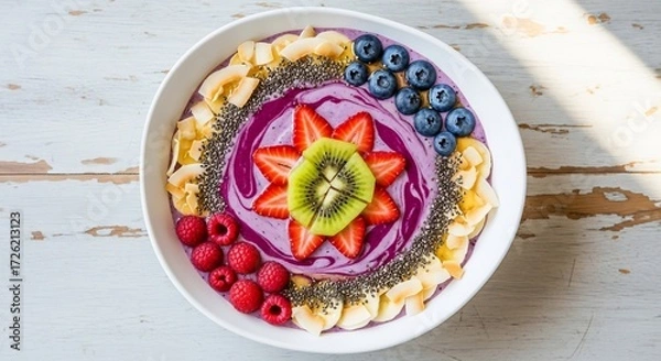 Obraz A purple smoothie bowl adorned with fruits nuts and seeds