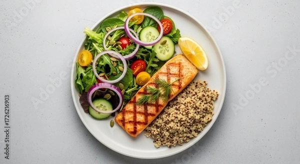 Fototapeta Grilled salmon with quinoa and salad served on a white plate
