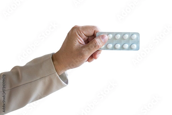 Fototapeta Man holding a strip of tablets. Isolated on transparent background.