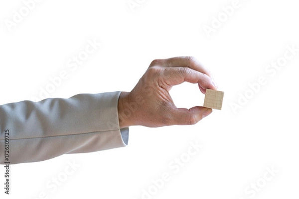 Fototapeta Businessman holding a piece of blank square wood block. Isolated on transparent background.