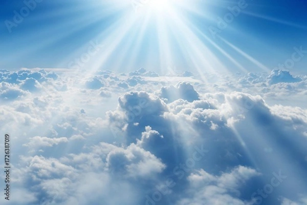 Obraz Breathtaking aerial view of fluffy white clouds meeting a vibrant blue sky with radiant sunbeams for a dreamy, heavenly escape, perfect for conveying peace and inspiration