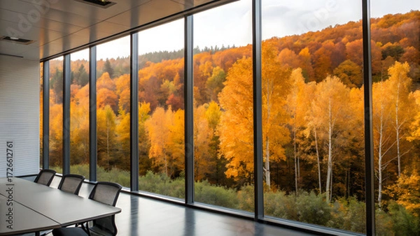 Fototapeta Resilient Ecosystem Business Modern conference room with large windows overlooking a vibrant autumn forest landscape.