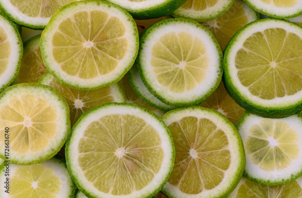Fototapeta Fresh lime slices close-up background