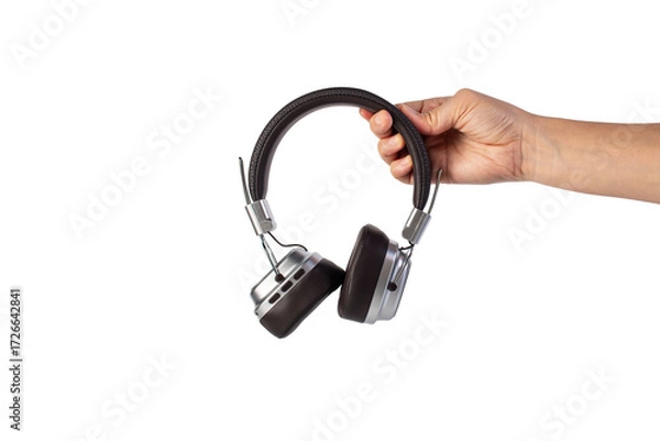Fototapeta Two-tone silver and brown wireless headphones, Headphones and hand isolate on transparent background. Wireless headphones in brown.
