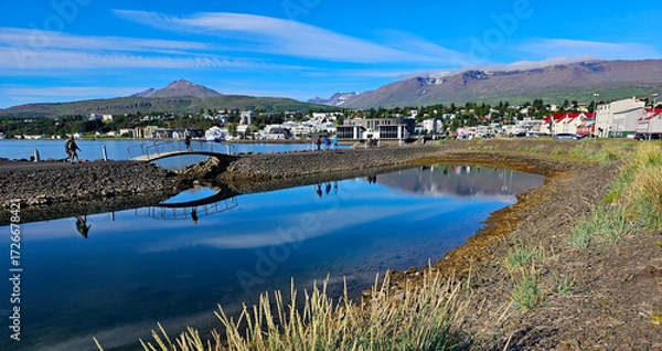Fototapeta Wonderful views of Iceland's second largest city, Akureyri, with expansive views of the mountains in the background.