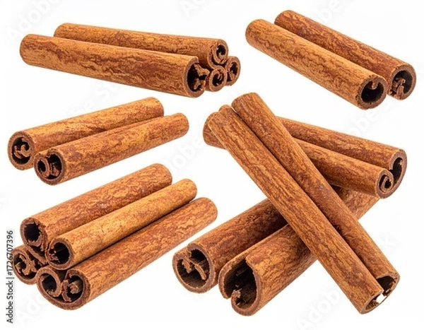 Fototapeta Assorted cinnamon sticks, close-up, on white