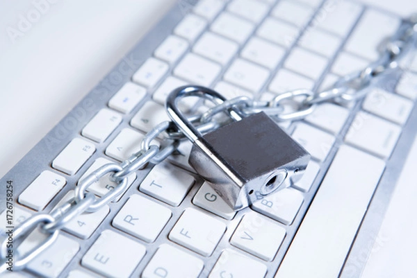 Fototapeta Lock and chain on the keyboard of a laptop. Internet security concept.