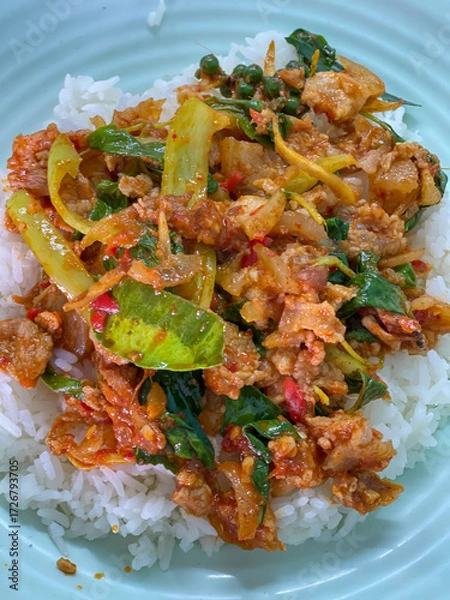 Fototapeta Rice topped with stir-fried pork and basil, Rice topped with stir fried minced pork and basil with Fried egg