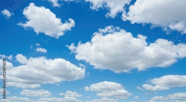 Fototapeta A vast expanse of a vibrant blue sky dotted with fluffy white clouds