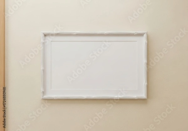 Fototapeta Minimalist rectangular white frame displaying a blank white canvas on a neutral beige wall, perfect for custom art or photo displays