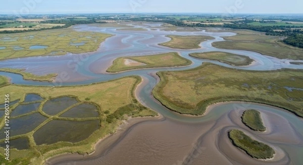 Fototapeta Aerial view of a network of winding waterways and marshland