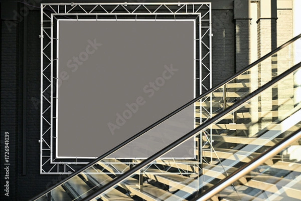 Fototapeta Aluminium and frame against escalator in sunny light
