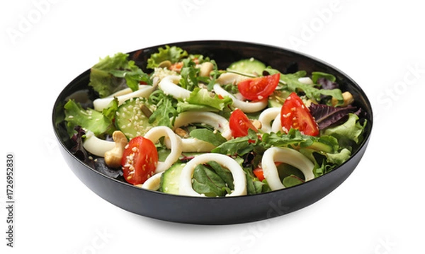 Fototapeta Delicious salad with squid rings, vegetables and nuts isolated on white