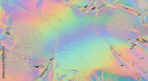 Fototapeta Iridescent surface with crystal formations and dark spots creating an abstract design