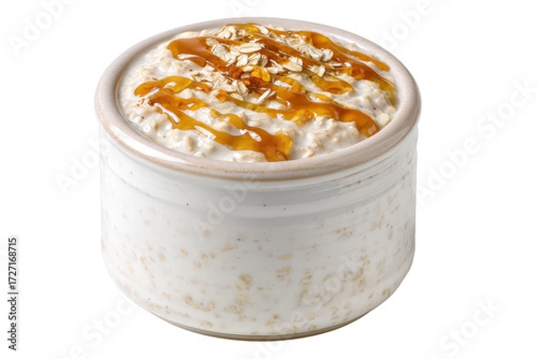 Obraz Creamy oatmeal with caramel drizzle and flaked almonds in a rustic bowl, isolated on transparent background