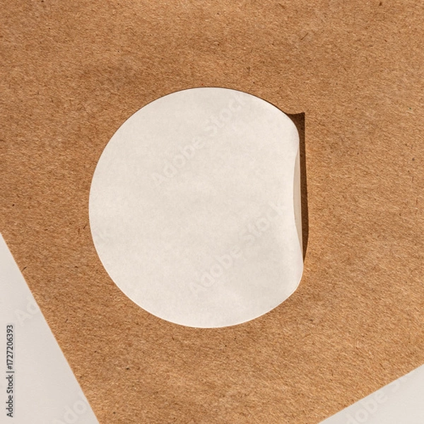 Obraz Minimalist round white sticker on brown textured surface with shadow
