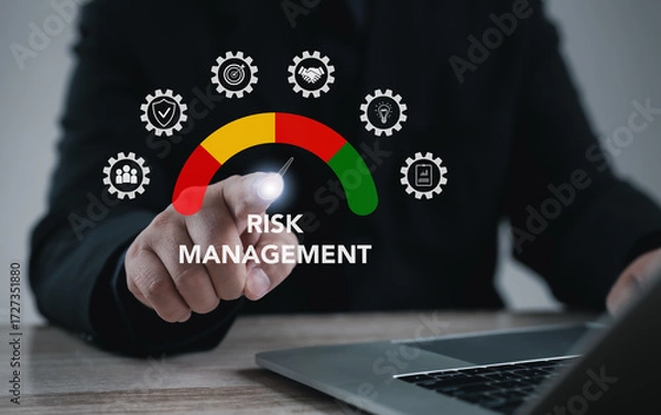 Fototapeta Executive pointing at risk management gauge on virtual interface, symbolizing strategy, business analysis, corporate planning, financial control, project safety, and effective decision-making.