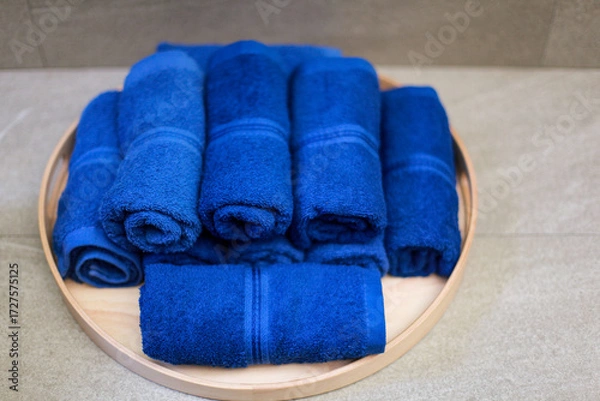 Fototapeta blue towel roll on tray, for spa or exercise