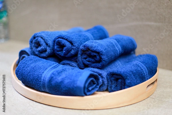 Fototapeta blue towel roll on tray, for spa or exercise
