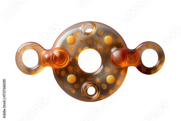 Fototapeta Amber colored plastic toy with star and circle patterns perfect for baby teething and sensory development on transparent background