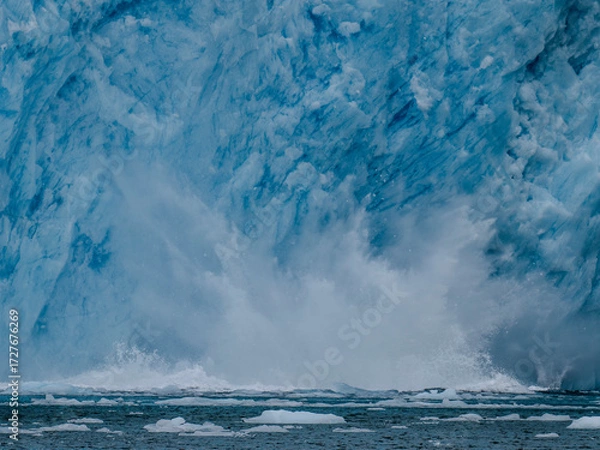 Fototapeta Capturing the explosion of water as ice sheets calve off the Aialak Glacier
