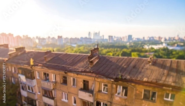 Obraz Blurred view of an aging apartment building in a cityscape during sunny golden hour