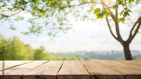Fototapeta Wooden Table Surface with Blurred Green Nature Background and Sunlight wood surface