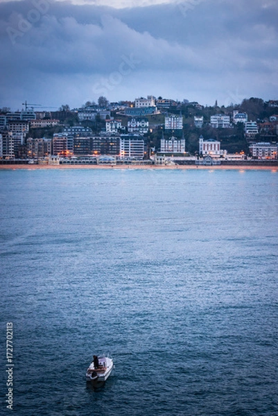 Obraz Small boat sailing in La Concha bay at Donostia-San Sebastian, at the Basque Country.
