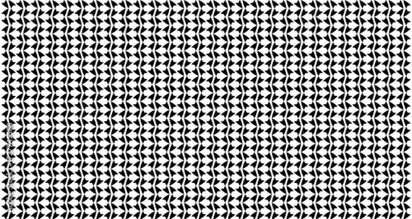 Fototapeta Black and white repeating pattern of stylized leaf shapes, creating a textured background.
