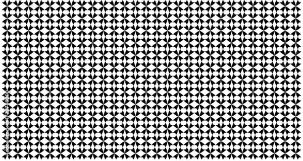 Fototapeta A repeating pattern of black and white diamond shapes forming a complex visual texture.