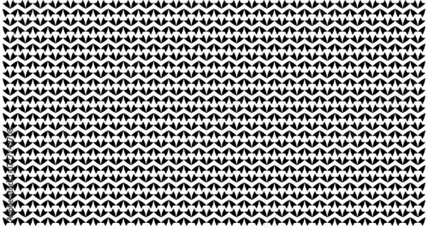 Fototapeta A seamless black and white geometric pattern featuring a dense, repeating texture of interlocking abstract shapes.