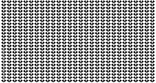 Fototapeta Dense pattern of small, repeating, black, teardrop-shaped elements on white background.