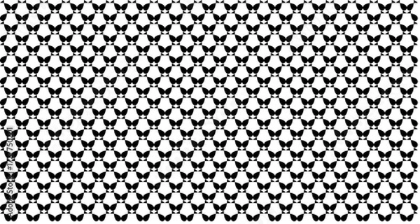Fototapeta A dense, seamless black and white pattern of stylized butterfly silhouettes creating a geometric background.