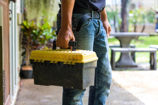 Obraz technician holding a toolbox
